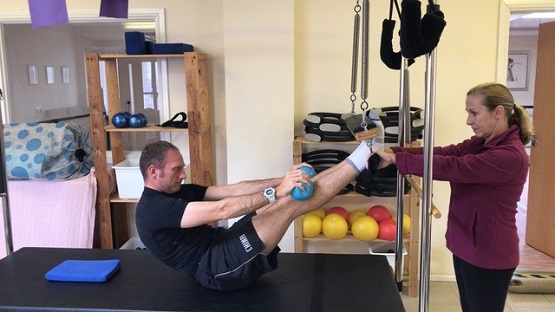 Jon Emmett doing Pilates